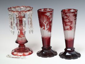 A pair of 19th Century octagonal Bohemian red overlay glasses vases decorated stags 25cm (chips to