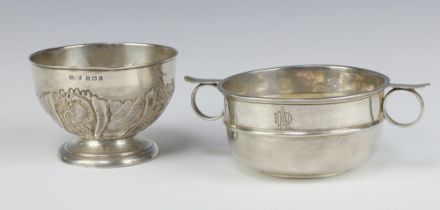 An Edwardian embossed silver sugar bowl Birmingham 1906 together with a silver twin handled bowl