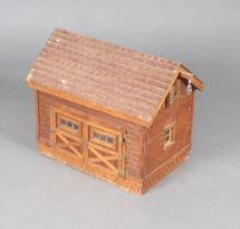 A 19th/20th Century scratch built wooden model of a barn, the interior fitted a manger 43cm h x 52cm
