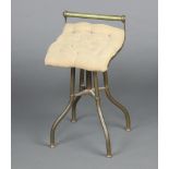 A Victorian gilt metal revolving harpist stool with buttoned back upholstered seat 60cm x 33cm x