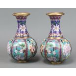 A pair of Japanese cloisonne enamel club shaped vases with panel decoration, decorated birds 26cm