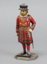 A 1930's table lighter in the form of a standing Beefeater 15cm Some paint loss