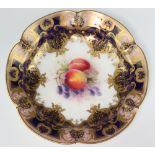 A Victorian Royal Worcester plate decorated peaches and grapes with blue and gilt banding 25cm,