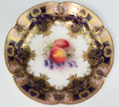 A Victorian Royal Worcester plate decorated peaches and grapes with blue and gilt banding 25cm,