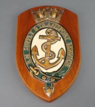 A Royal Navy Supply and Transport Service wall plaque 32cm x 19cm