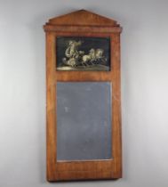 A 19th Century Continental rectangular plate pier mirror in a walnut frame decorated with an
