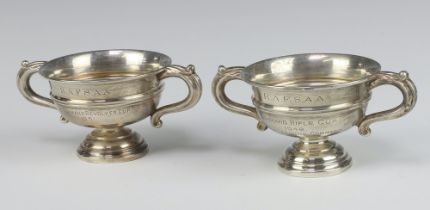 A pair of silver twin handled trophy cups Birmingham 1950, 194 grams