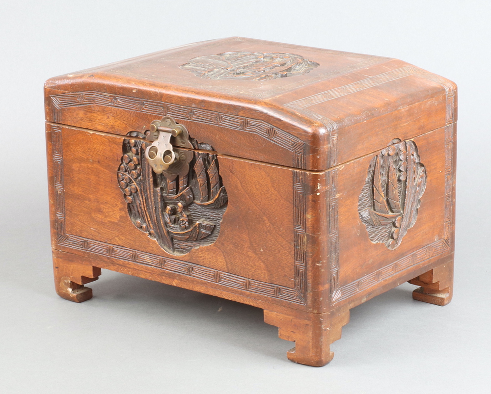A 1930's miniature carved camphor coffer with hinged lid 20cm h x 29cm w x 19cmd Some contact