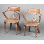 A pair of Victorian tub back office chairs with solid seats on turned supports 77cm h x 57cm w x