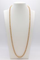 A yellow metal rope twist chain marked 585, 66cm, 20.7