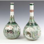 A pair of 19th Century Chinese famille vert porcelain club shaped vases of panelled decoration,