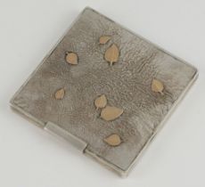 A white metal square compact with leaf decoration 7.5cm x 7.5cm