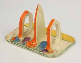 A Clarice Cliff crocus pattern 3 bar toast rack 7cm Some paint loss in places