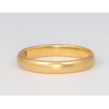 A 22ct yellow gold wedding band, size L, 3.1 grams