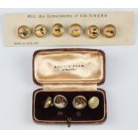 Six Guinness Toucan advertising dress studs together with a pair of gilt metal cufflinks decorated