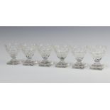 Six 19th Century circular cut glass table salts raised on square bases 9cm