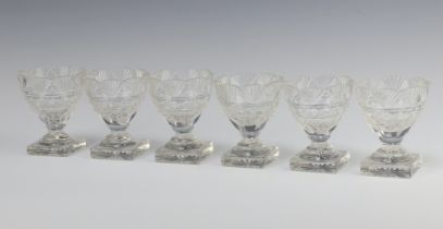 Six 19th Century circular cut glass table salts raised on square bases 9cm