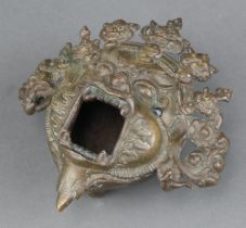 An Eastern bronze mask/pot, in the form of a grotesque, raised on 3 plain feet 5cm x 5cm x 5cm