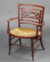 A 19th Century mahogany bar back open arm chair with oval seat raised on turned supports 70cm h x