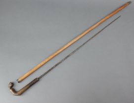 A 19th Century sword stick with 59cm stiletto blade, horn handle in the form of a horses hoof