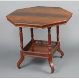 A Victorian octagonal mahogany occasional table with square undertier and pierced gallery raised