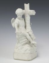 A French Parian figure of an angel seated by a cross 32cm x 13cm x 12cm One wing is damaged
