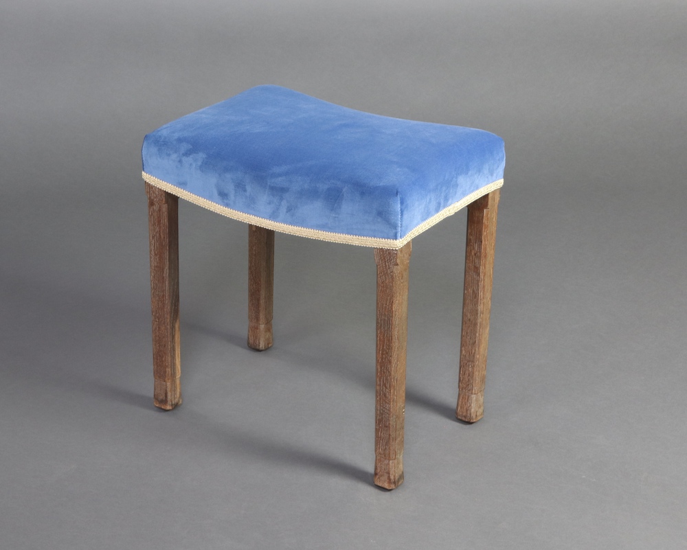 An Elizabeth II limed oak Coronation stool by Waring & Gillow re-upholstered in blue velvet and gold