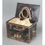 A Second World War ARP First Aid tin containing a tourniquet, five first field dressings, 5 shell