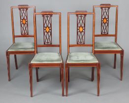 A set of 4 Edwardian inlaid mahogany pierced and slat back dining chairs with upholstered seats,