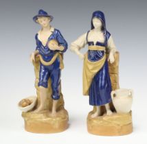 A pair of Royal Dux bisque porcelain spill vases in the form of a standing boy and girl, the base