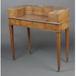 An Edwardian bleached mahogany Carlton House desk, the arched back fitted 12 drawers, the base