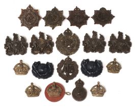 A quantity of Second World War plastic military cap badges