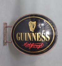 Guinness, a plastic and metal framed double sided hanging sign marked Arthur Guinness 91cm h x