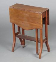 An Edwardian inlaid and crossbanded mahogany shaped Sutherland table raised on outswept supports