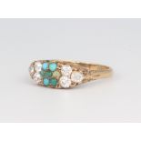 An 18ct yellow gold dress ring set turquoise and 6 diamonds to the shoulders (1 turquoise broken),