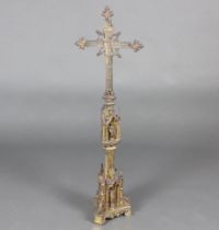 A Gothic pierced gilt metal cross raised on a triform base 106cm h x 33cm w x 20cm d