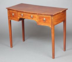 A 19th Century inlaid mahogany bow front side table fitted one long and two short drawers with brass