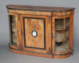 A Victorian figured walnut and ebonised credenza, the centre enclosed by a panelled door flanked
