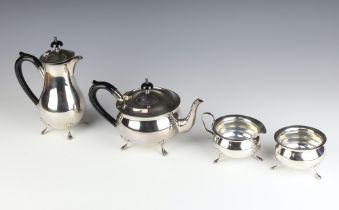 A stylish silver plated ebony mounted tea and coffee set on pad feet