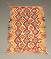 A green, orange and white ground Chobi Kilim rug with all over geometric design 118cm x 82cm