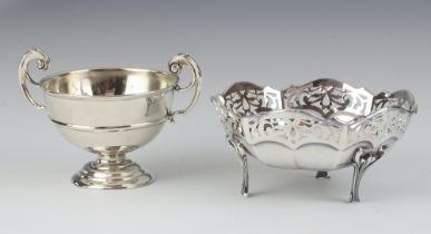 A silver twin handled trophy cup London 1911 together with a circular silver bowl with pierced