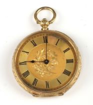 A Continental open faced key wind fob watch with gilt dial and Roman numerals, contained in a yellow