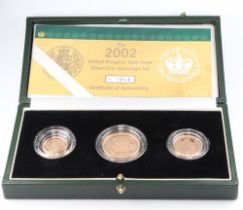 A 2002 Elizabeth II Golden Jubilee sovereign set comprising sovereign, two pound coin and half