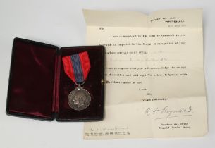 A George V Imperial Service medal to William Howard of The Ordnance Survey, together with letters of
