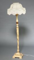 A 1930's white lacquered chinoiserie hexagonal turned standard lamp, on a square base 153cm h This