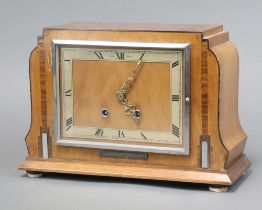 Smith Enfield, an Art Deco mantel clock with rectangular silvered dial with Roman numerals contained