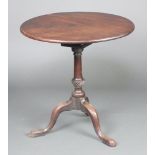 A 19th Century circular snap top tea table with bird cage action on a turned column and tripod