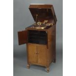 A His Master's Voice standard gramophone model 192, contained in a mahogany case enclosed by
