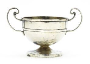 A Chinese export silver twin handled trophy cup of squat form marked under WH 90 for Wang Hing & Co.