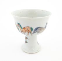 A Chinese pedestal wine cup / bowl decorated with horses. Character marks under. Approx. 5" high